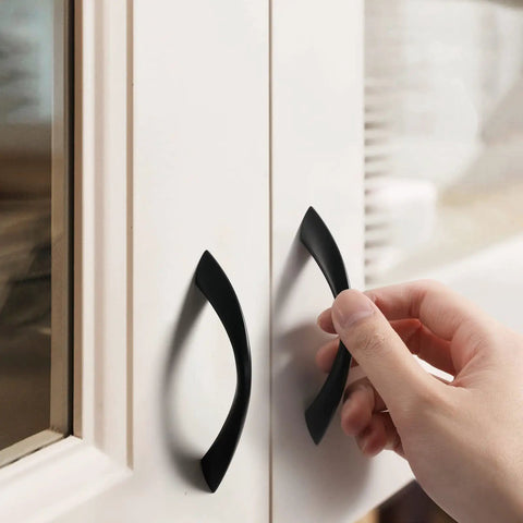 3 Inch Arch Twisted Matte Black Cabinet Pulls 10 Pack Heavy Duty Zinc Alloy Handles installed on white cabinet