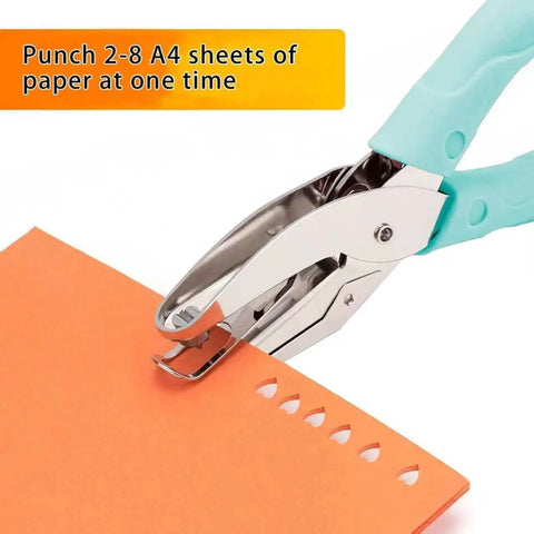 Close-up of blue Two Pack Handheld Heart And Star Shape Hole Punches With Ergonomic Soft Grip used on orange paper