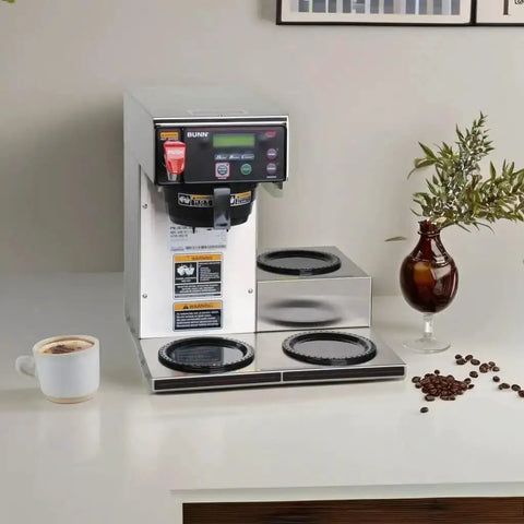 Front view of Dual Voltage Commercial 12 Cup Coffee Maker With Back To Back Brews Three Warmers Large 200 Oz Tank Programmable Brew Level And Temperature Cold Brew Lockout Grey Finish Built For Busy Cafes And Offices