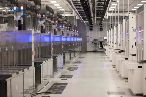 Modern electronics manufacturing facility with rows of equipment, showcasing a setting ideal for Conductive Grid Tape For EMI Shielding And ESD Protection.