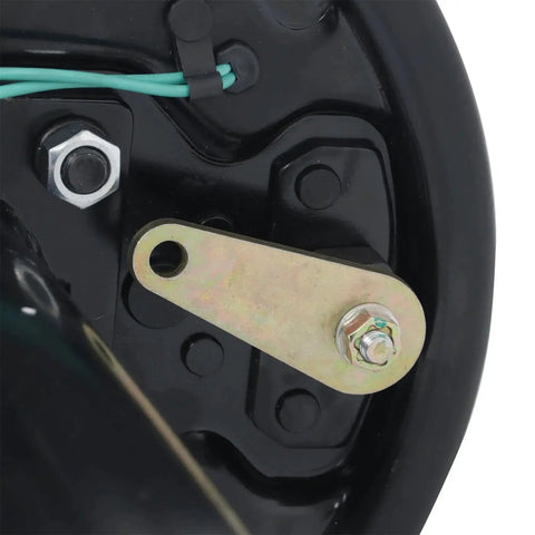 Close-up of electric trailer brake axle mounting strap in brass color with green wires