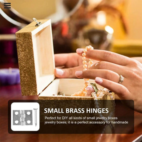 Person holding pearl necklace over open jewelry box with small brass hinges visible, perfect for DIY jewelry boxes.