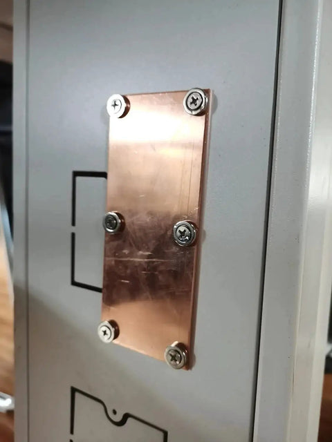 Magnetic Copper Welding Spoon Backing Set For Butt Welds Two 5 Inch Copper Panels with screws on metal surface