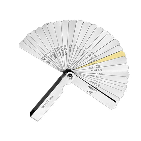 Steel thickness gauge with fan of blades extended, showing measurements in millimeters, tool for precision measurement.