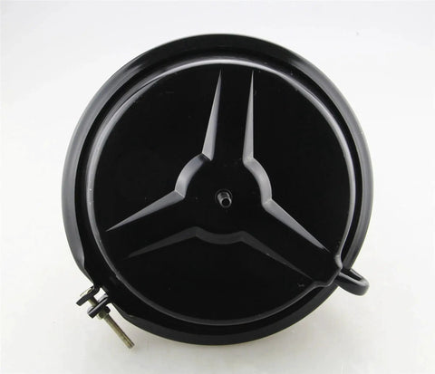 Brake booster front view, round black disc with three-spoke hub design and mounting bolts visible