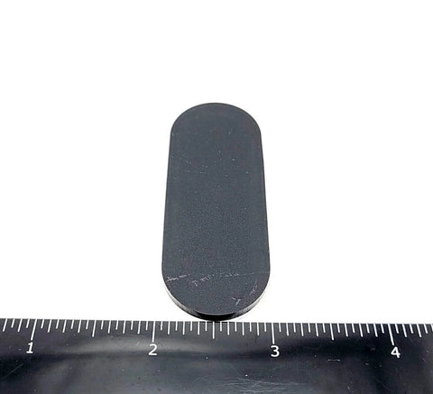 Two And A Half Inch Oval Silicone Rubber Bumper Feet One Eighth Inch Thick With Adhesive Backing next to ruler measurement