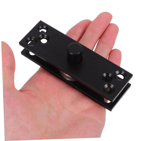 Close-up of 360 Degree Hidden Door Hinge Stainless Steel Pivot For Secret Doors showcased on hand, black finish, compact design.