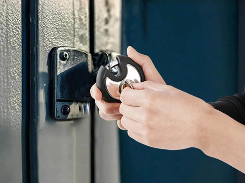 Person using Outdoor Stainless Steel Disc Padlock With Waterproof Shield And Rubber Bumper For Sheds Gates And Fences Heavy Duty Keyed Padlock