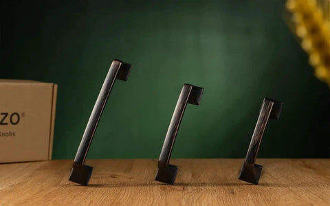 Oil Rubbed Bronze 5 Inch Cabinet Pulls Pack Of 10 Solid Metal Contemporary Big Square Arch Handles on wooden surface