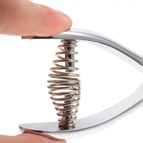 Compact Manual Oval Hole Puncher For IDs And Office Paper, Rugged Metal Single Hole Punch Tool spring mechanism close-up