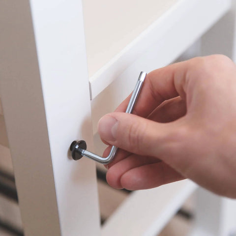 Hand using an Allen wrench to install heavy duty hex socket self tapping screws one quarter inch by one and five eighths inch 410 stainless steel.