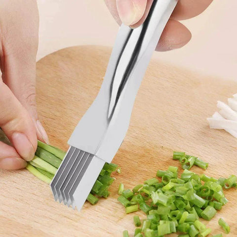 Close-up of Game Changing Mandoline Slicer For The Kitchen Pro Grade Vegetable Cutter And Potato Slicer in use cutting scallions.