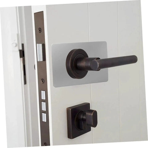 Stainless Steel Door Reinforcement Plate Set 6 Pieces No Drilling Deadbolt Cover And Repair Panel For Apartment Doors Keepin It Secure Rustproof Easy Install Durable installed on a white door with a black handle.