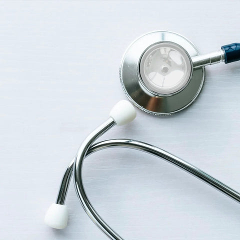 NOLITOY two-piece stethoscope diaphragm replacements; white diaphragms with chrome chest piece and blue tubing.