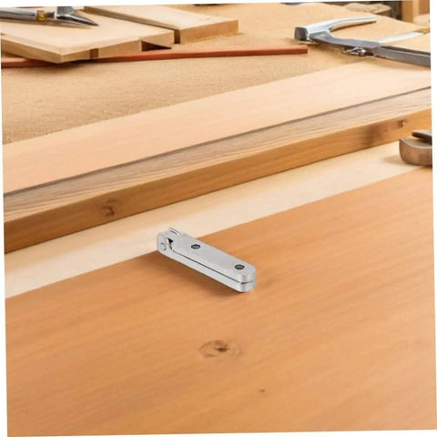12 Pack Zinc Alloy 90 Degree Folding Hinges For Jewelry Boxes And Small Cabinets, on a wooden surface in workshop