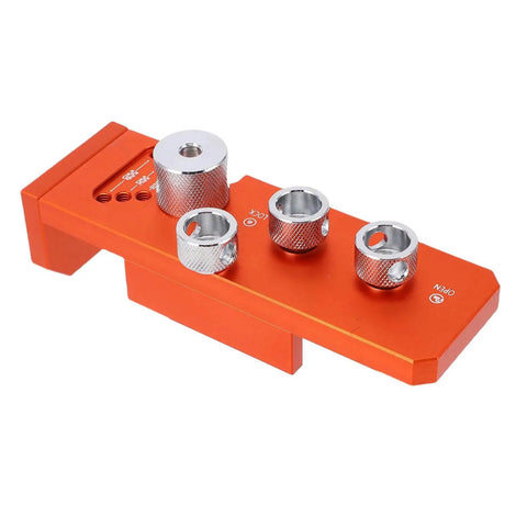 Integrated Aluminum Profile Drill Jig For Automated Assembly Lines, orange anodized finish, viewed from top angle.