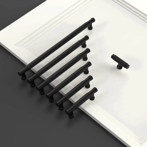 10 Pack 3.75 Inch Matte Black Knurled Cabinet Pull Handles for kitchen cabinets, shown on a white board, illustrating size and style.