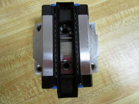 Top view of R165129310 Ball Carriage Rexroth Kugelwagen for Linear Guide Rails with metal and black sections