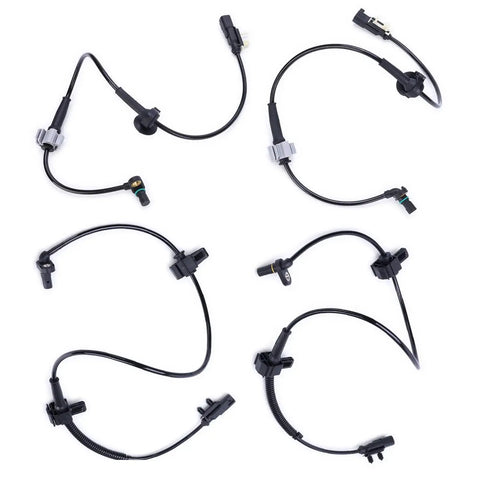 Set of four black ABS wheel speed sensors with wiring harnesses for front and rear wheels