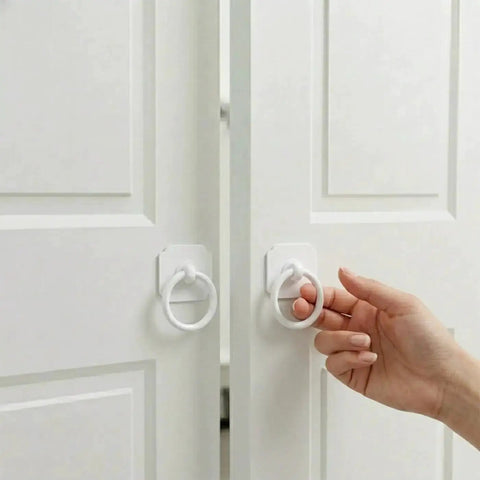 Large White Ring Bi-Fold Closet Door Pulls With Protective Base 1-3/5 Inch, 4 Pack being installed on bifold doors