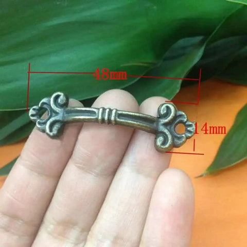 Close-up of 10 Pack Antique Brass Zinc Alloy Mini Jewelry Box Drawer Cabinet Knob Pull Handle showing 48mm diameter.