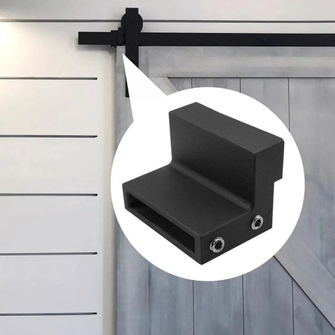 Barn Door Roller Stopper Set For Flat Track Sliding Doors Noise Reducing Metal With Rubber Gasket Includes Mounting Wrench Two Pieces Track Width Compatible Hardware Black Powder Coated Finish shown in use on a sliding door.