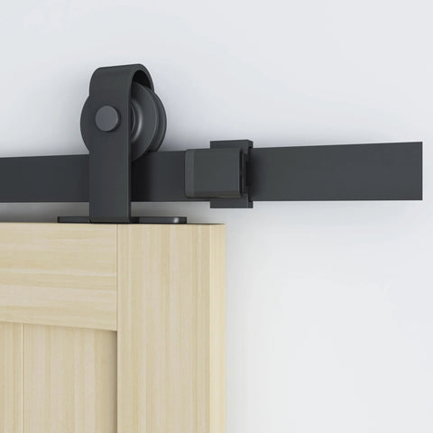 Close-up of 6 Ft Sliding Barn Door Hardware Kit With Top Mounted Track for Aluminum Glass Doors, matte black nylon wheel system.