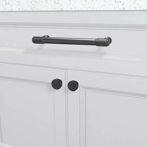 10 Pack Five Inch Matte Black Cabinet Handles Knurled Drawer Pulls For Cabinets Closets Drawers Dressers Doors And Kitchen Furniture Hardware installed on a white kitchen cabinet