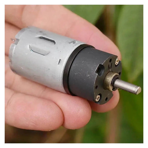 Close-up of Beefy 24mm 370 Planetary Gearbox with full metal gears, shown in hand, DC 12V, 30 RPM, for robotics and hobbyists