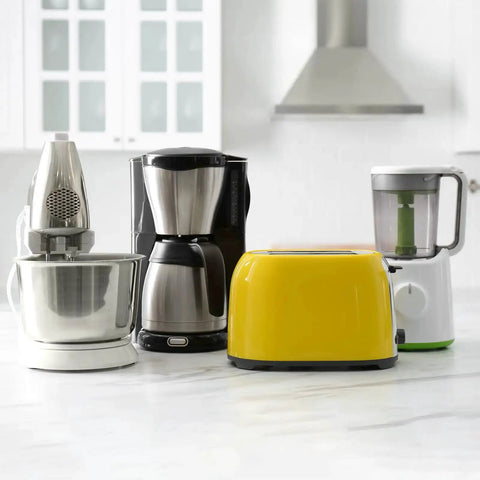 Kitchen countertop with a mixer, coffee maker, toaster, and blender in a modern kitchen setting.