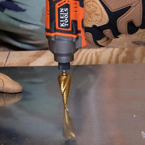 Heavy Duty Step Drill Bit Set For DIY With Spiral Double Fluted Titanium Nitride Coated Bits in use on metal surface