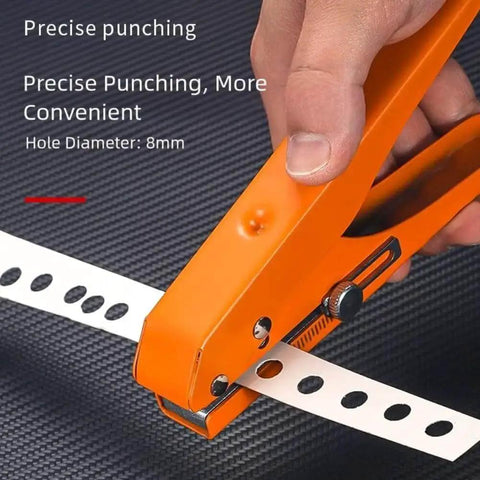 Close-up of orange Pro Grade 15mm Hole Punch Pliers with Fixed Guide punching holes in paper, ergonomic anti-slip grip visible