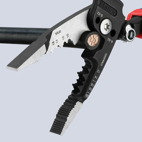 Close-up of Knipex Forged Wire Stripper 13 72 8 8 Inch cutting solid copper wire, showing shear blades and measurements.