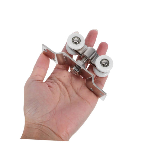 2 Pack Sliding Door Rollers Stainless Steel With Silent Nylon Wheels held in hand for size reference