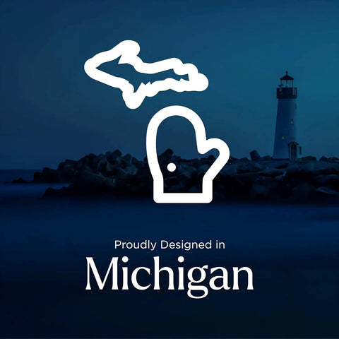 Outline of Michigan with lighthouse background and text reading 'Proudly Designed in Michigan'