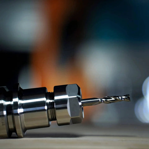 Close-up view of a drill bit from the Five Piece CNC Router Bit Set For Serious Woodworking Enthusiasts With One Quarter Inch Shank And One Quarter Inch Cutting Diameter.