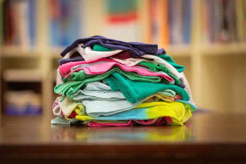 Stack of assorted color low lint reclaimed cotton polo shop rags for auto home and workshop use, eco-friendly upcycled towels.