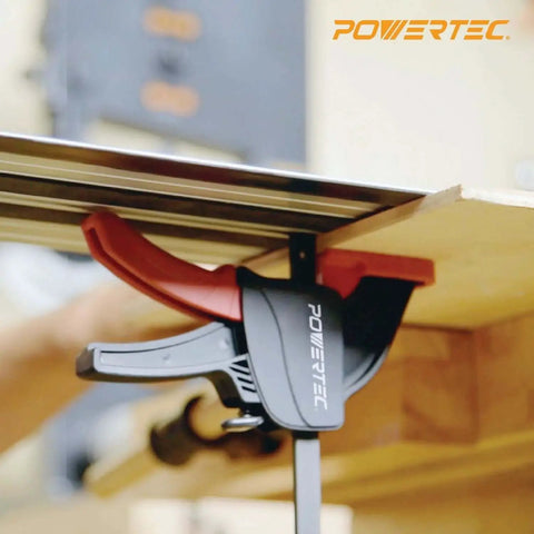 Side view of POWERTEC quick-release track saw clamp set attached to guide rail for T-track channel use.