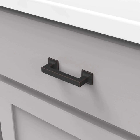 Studio Collection Cabinet Pull Three Inch Center To Center Oil Rubbed Bronze Highlighted Finish installed on drawer
