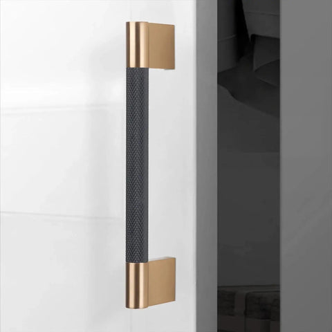 Ten Pack Knurled Cabinet Handles Center To Center Five Inch Black And Champagne Copper Kitchen Cabinet Hardware installed on door