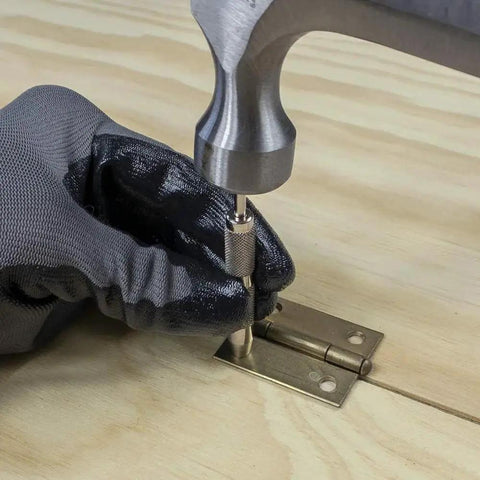 Jiffy Centering Punch For Quick Screw Hole Start In Hinges And Brackets With An Automatic Centering Tip That Slips Right Into Countersunk Holes, Durable Silver Tool From General Tools 806 being used on a hinge