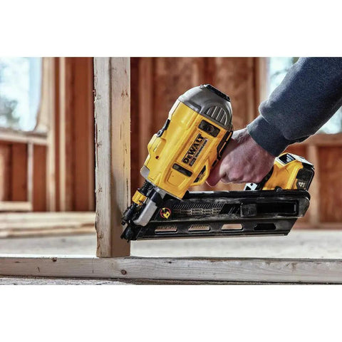DEWALT 20V MAX XR Framing Nailer delivers cordless, dual-speed power driving nails into lumber on a construction site.