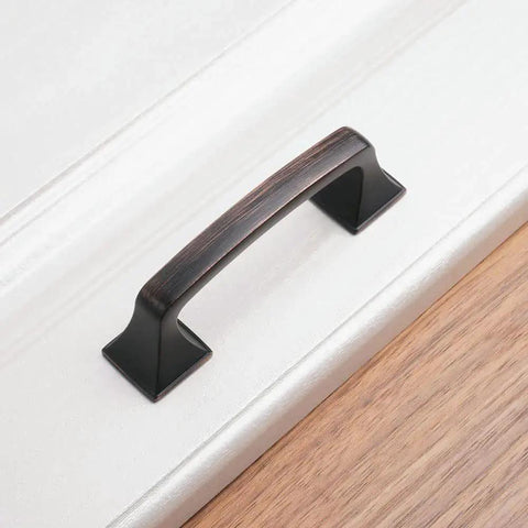 Oil Rubbed Bronze Big Square Foot Cabinet Arch Pull Handle With 3 Inch Spacing 76mm installed on white cabinet
