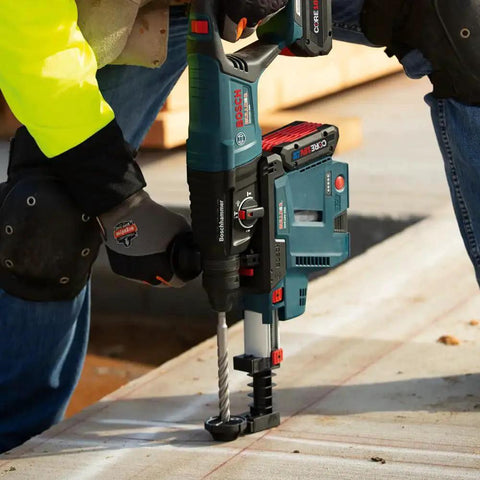 Worker using Four Cutter Carbide Tipped Bulldog Head Rotary Hammer Drill Bit For Concrete With Rebar, SDS-Plus, 1-1/8 x 8 x 10 In
