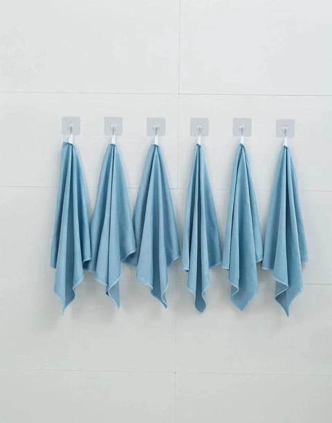Six blue microfiber cloths hanging, illustrating 12 Pack Microfiber Glass Cleaning Cloths 12x16 Inches Lint Free Blue