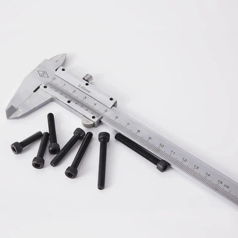 M5 Hex Socket Head Cap Screws Set With 20mm, 25mm, 30mm, 35mm, 40mm Lengths, 12.9 Grade Alloy Steel, Black Oxide Finish next to a caliper