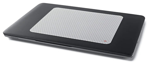 Precise Mouse Pad With Repositionable Adhesive Back For Optical Mice At High Speeds, shown on a closed laptop notebook.