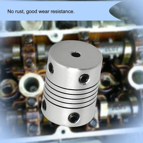 2 Pack Flexible Beam Couplings 4mm To 8mm Shaft, 19mm Outer Diameter, 25mm Length, M4 Screws, shown with engine parts