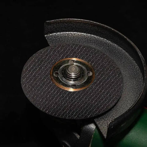 Close-up of a die grinder with metal cutting disc, part of the Six Piece Cut Off Wheel Set For Die Grinder With One Quarter Inch Stem Mandrel