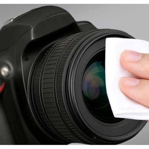 Person cleaning camera lens with wipe from Glasses Cleaning Kit With 24H Anti Fog Spray Microfiber Cloths Brush Wipes.